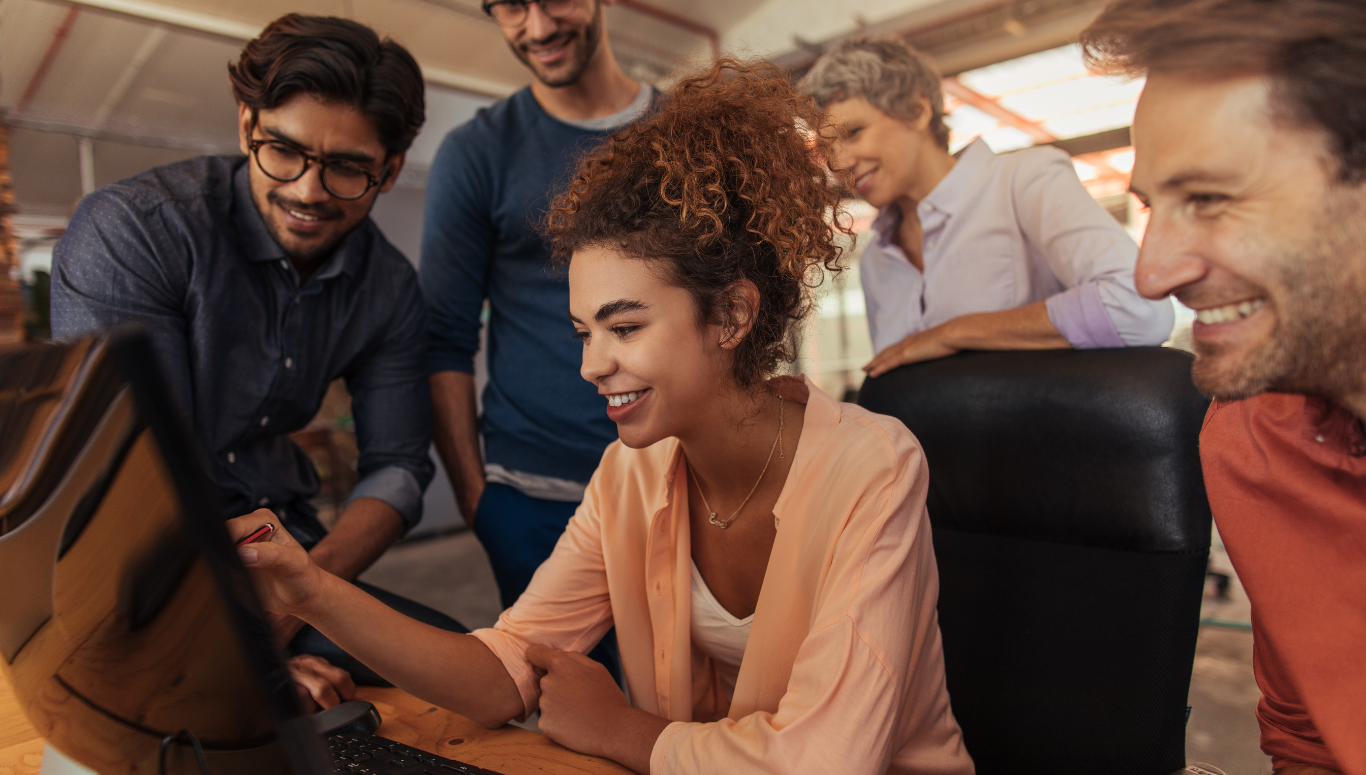 a group of people looking into monitor